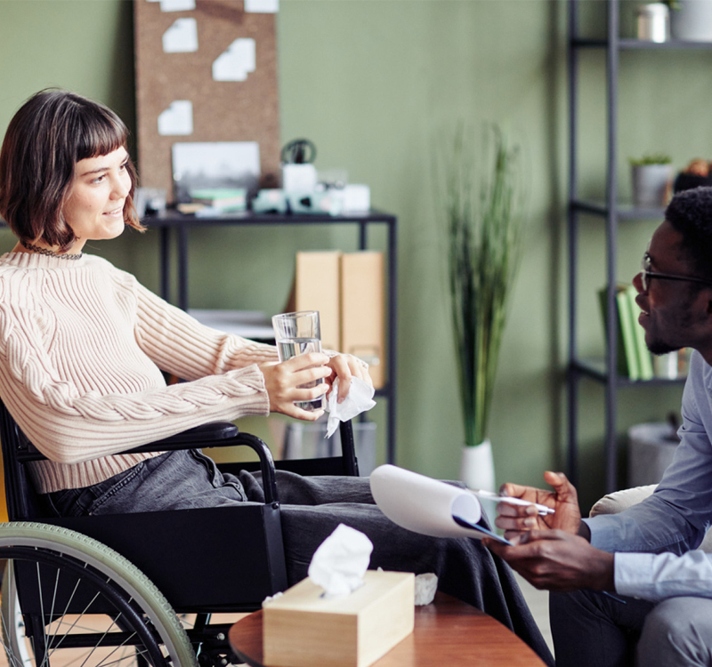 NDIS Support Coordination session with participant in a wheelchair